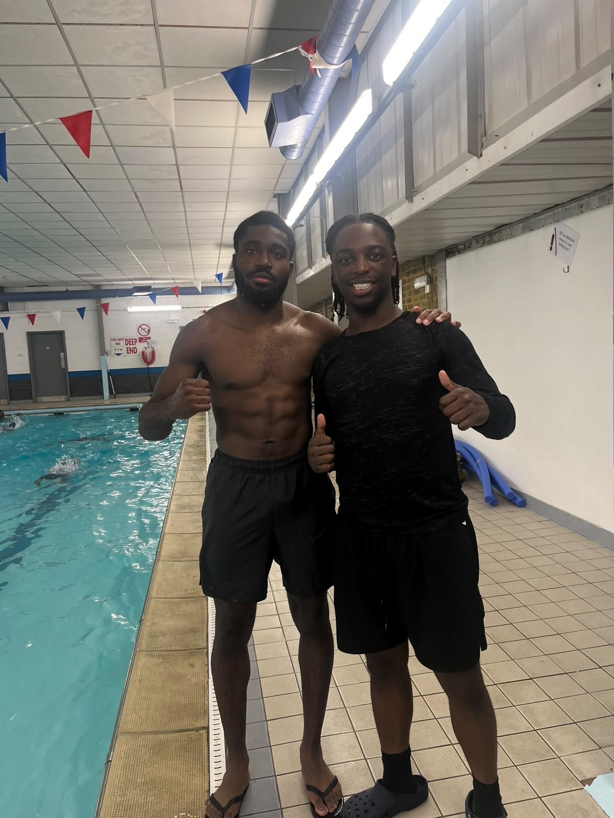 Adriel Ogunjebe, Aqua Jetz swimming instructor, poolside at Harris Academy